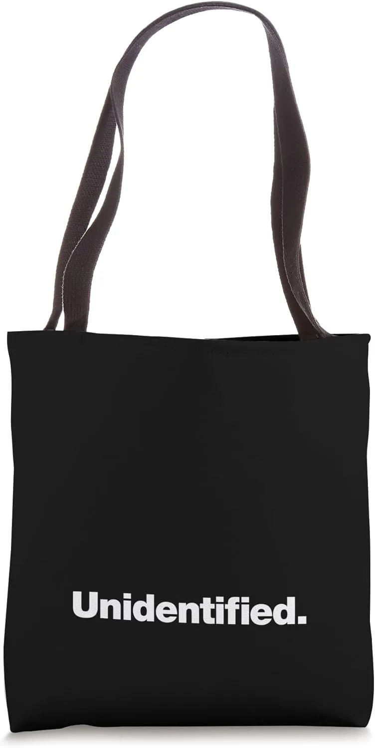 The word Unidentified | A design that says Unidentified Tote Bag